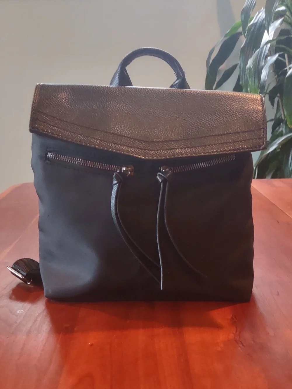 Botkier Black Backpack with Textured Flap, Adjustable Straps And Zip Pockets